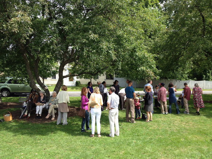 Parishioners spend time together outside on a spring day